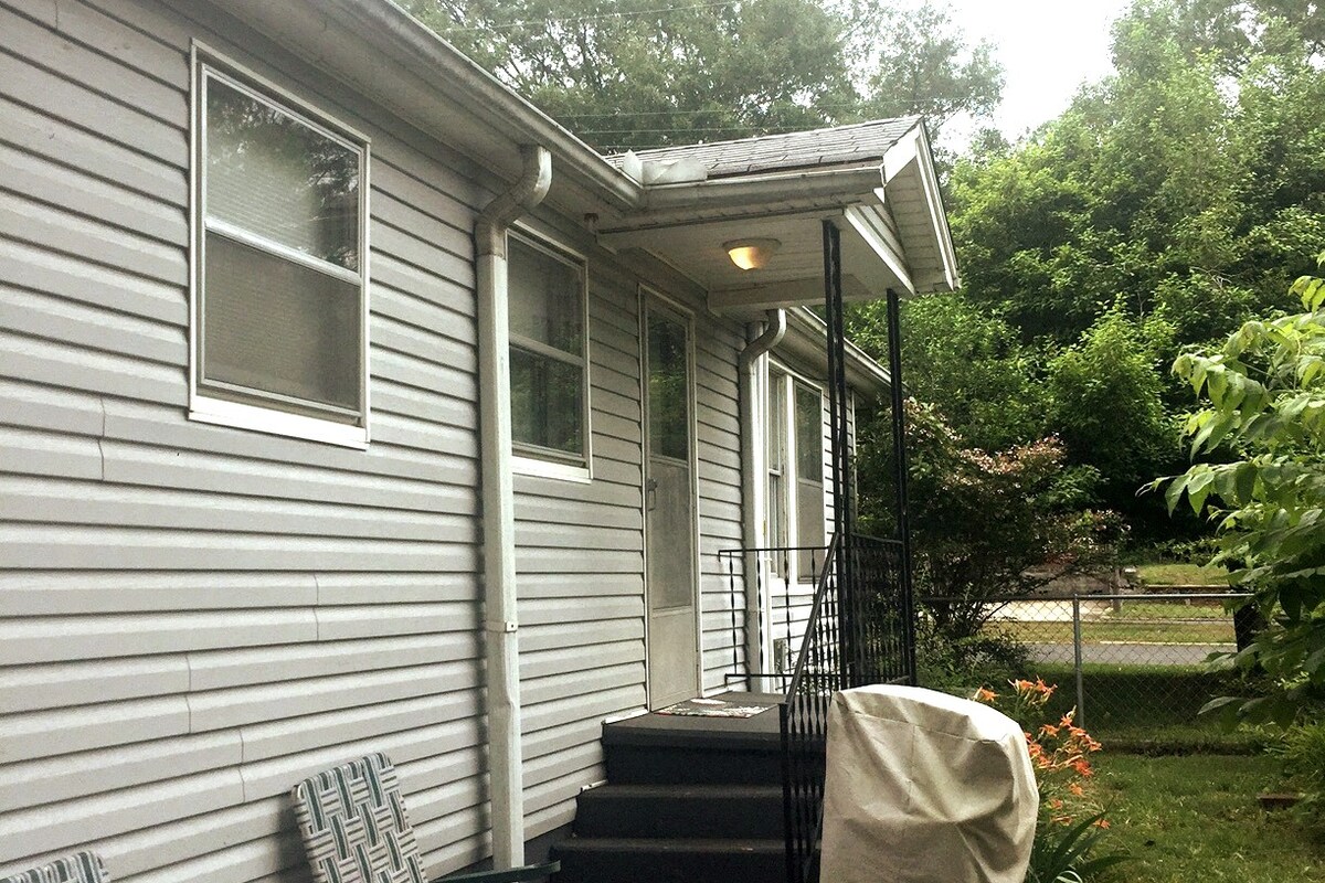 Patio Area in small fenced yard off the kitchen, with BBQ Grill.